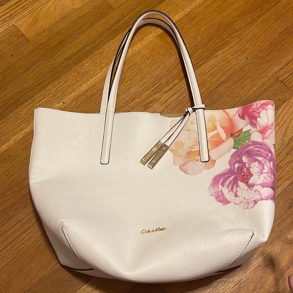 Calvin Klein purse. White with flower design. Used.